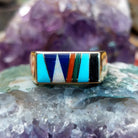 Multistone inlay ring in 14K yellow gold by Steve Francisco, featuring a vibrant mosaic of carefully fitted natural stones set within a polished gold band.
