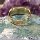 Multistone inlay ring in 14K yellow gold by Steve Francisco, featuring a vibrant mosaic of carefully fitted natural stones set within a polished gold band.  Underside view.