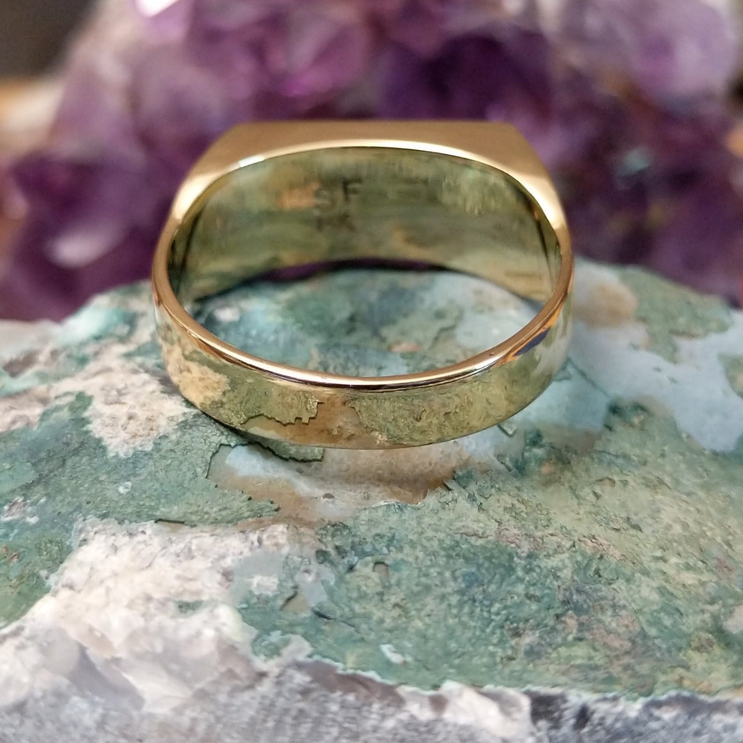 Multistone inlay ring in 14K yellow gold by Steve Francisco, featuring a vibrant mosaic of carefully fitted natural stones set within a polished gold band.  Underside view.