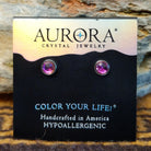 Aurora halo crystal stud earrings by LeightWorks, featuring faceted crystals surrounded by a sparkling halo setting with brilliant light-reflecting detail.