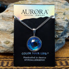 Aurora Eclipse crystal necklace by LeightWorks, featuring a sparkling faceted crystal pendant with brilliant light-reflecting detail on an elegant necklace chain.