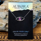 Aurora Eye necklace by LeightWorks, featuring a sparkling crystal pendant with faceted details with an eye shaped design.