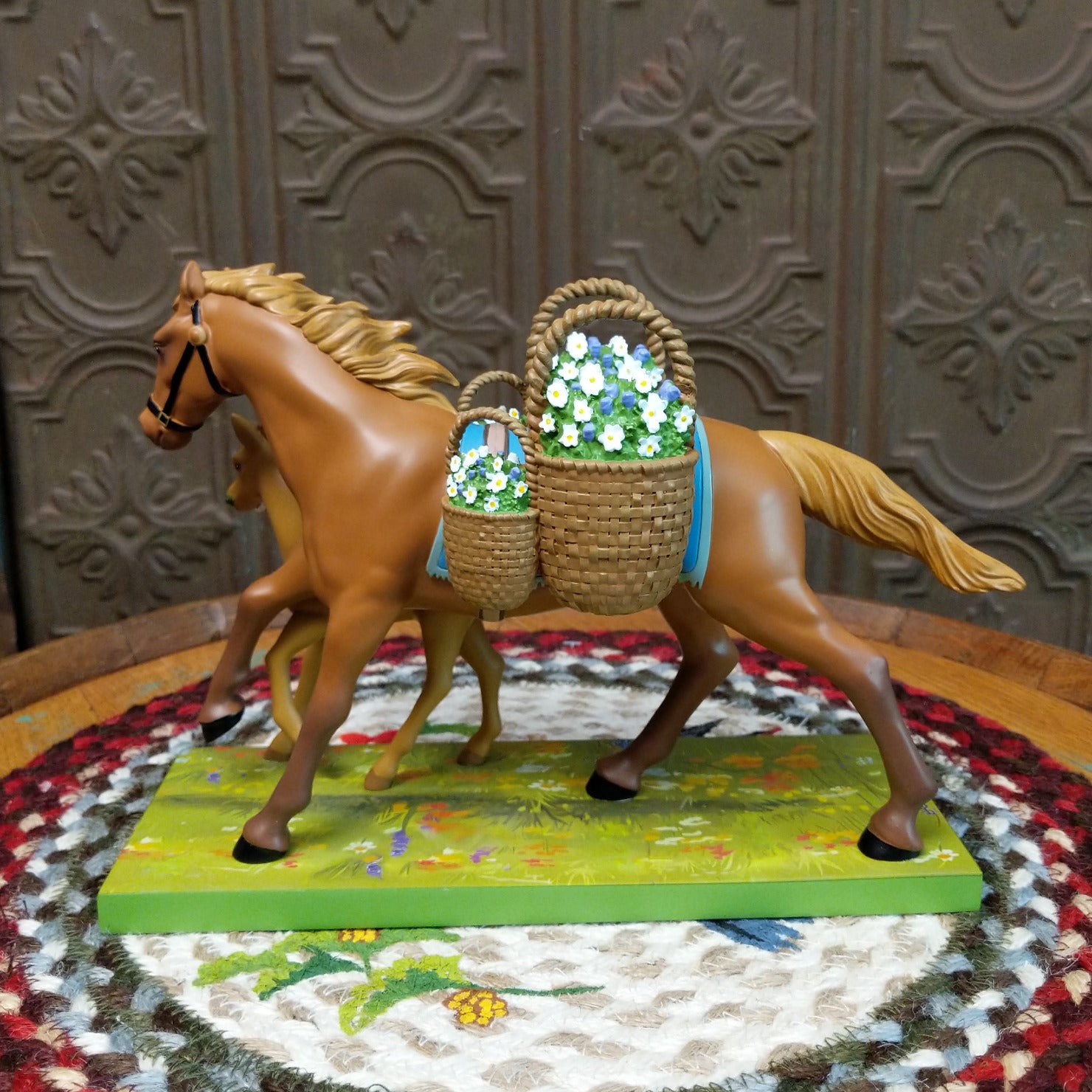 "Mama's Helper" collectible pony by The Trail of Painted Ponies, featuring detailed hand-painted artwork, vibrant colors, and family-inspired design elements.