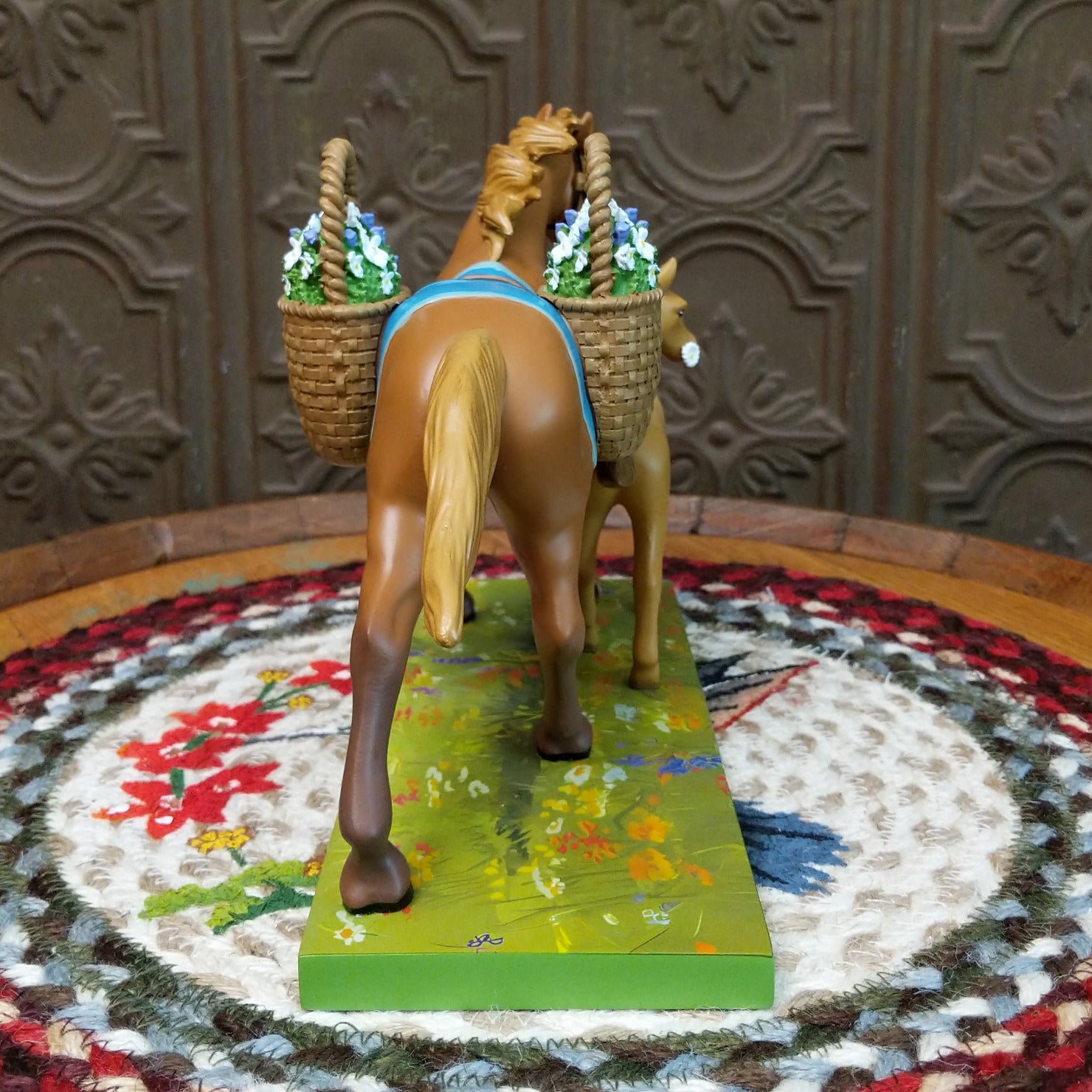 "Mama's Helper" collectible pony by The Trail of Painted Ponies, featuring detailed hand-painted artwork, vibrant colors, and family-inspired design elements.  Rear view.