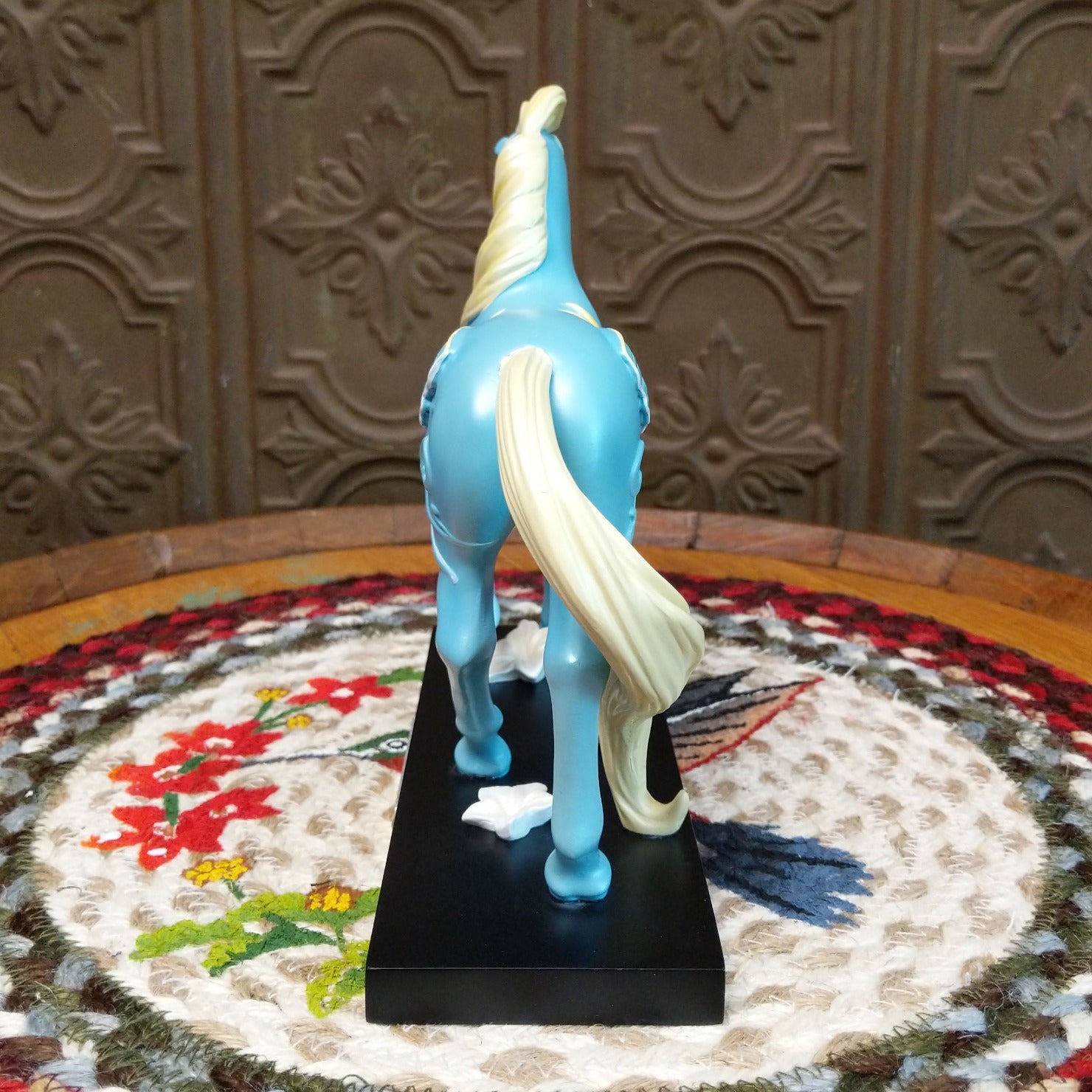"Summer Moon" collectible pony by The Trail of Painted Ponies, featuring detailed hand-painted artwork, moon-inspired design elements, and rich vibrant colors.  Rear view.