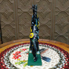 "Wildflower" collectible pony by The Trail of Painted Ponies, featuring detailed hand-painted floral artwork, vibrant colors, and nature-inspired design elements.  Rear view.