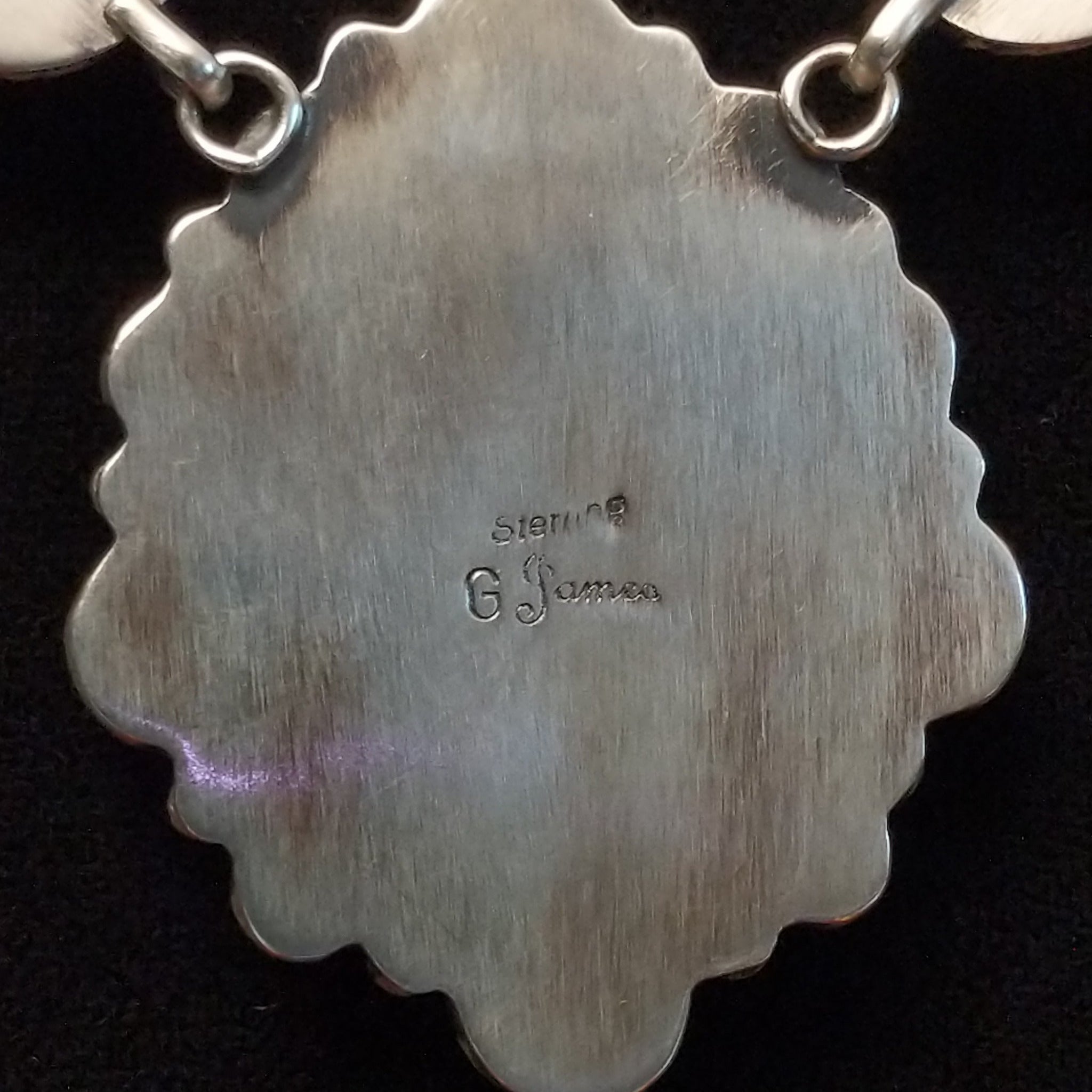 Artisan and Sterling Silver stamp.