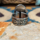 Handcrafted sterling silver Palomino Variscite oval ring by Raymond Coriz, featuring a natural green and white variscite gemstone with a beaded bezel; underside view.