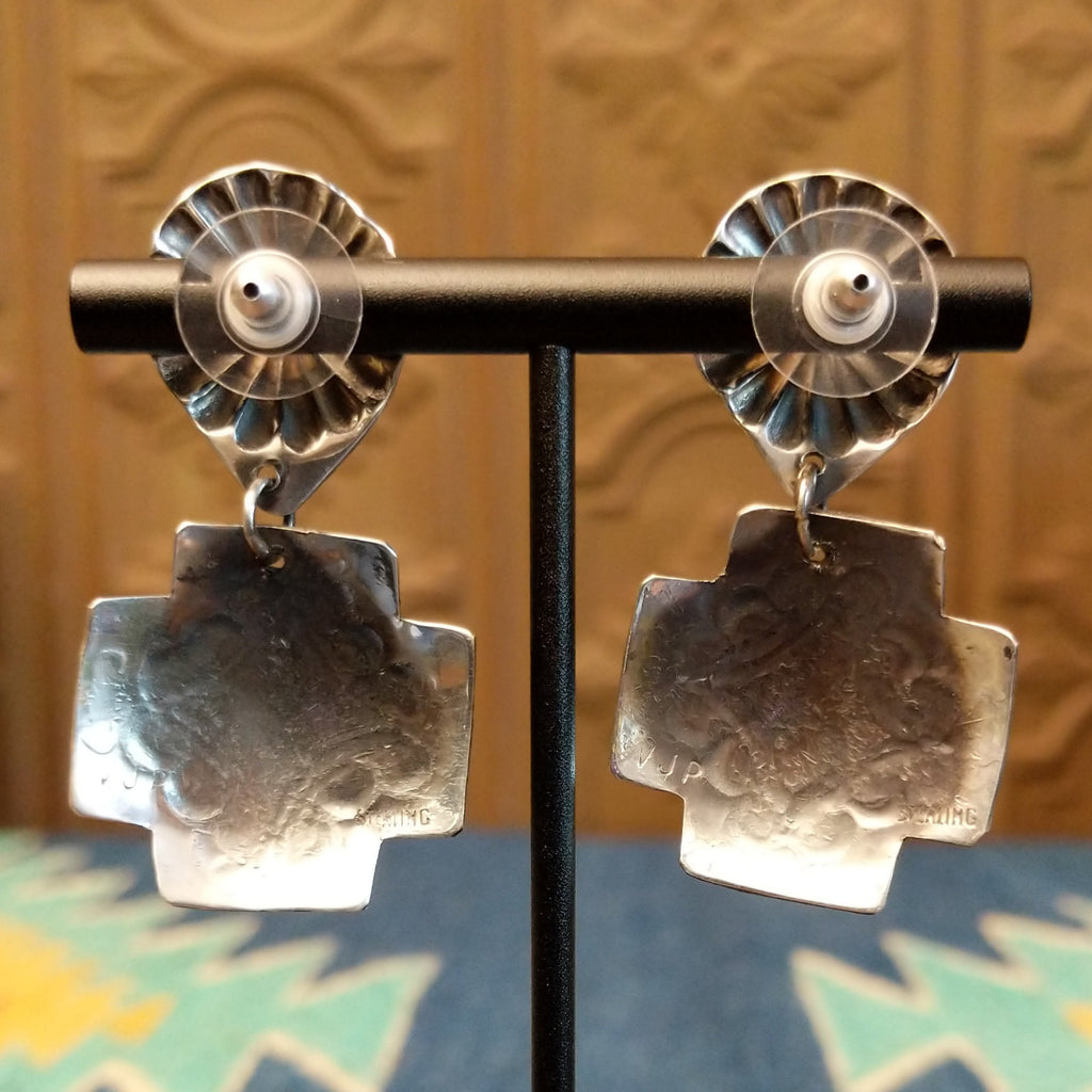 The sterling silver stamp is found on the backs of the earrings.