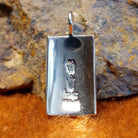 The artisan's stamped signature is found on the back.