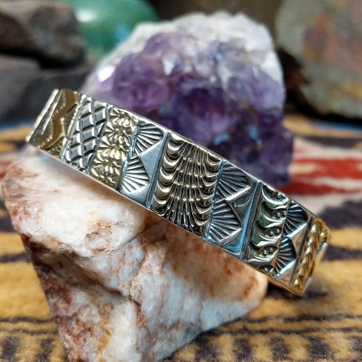 Sterling silver and 14k gold cuff by Marc Antia with alternating patterned panels.