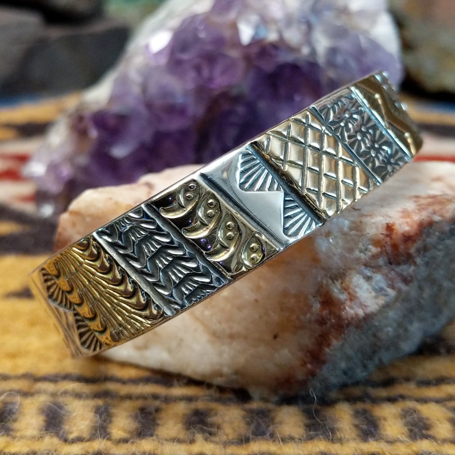 Sterling silver and 14k gold cuff by Marc Antia with alternating patterned panels.