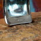 Close up of the artist's stamped signature