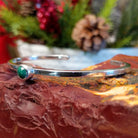 Thin sterling silver cuff bracelet with petite malachite stone set in the bezel.