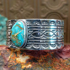 Sterling silver cuff with Sonoran gold turquoise set in twisted rope bezels. 