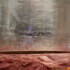 Close-up of the artist's stamped signature.