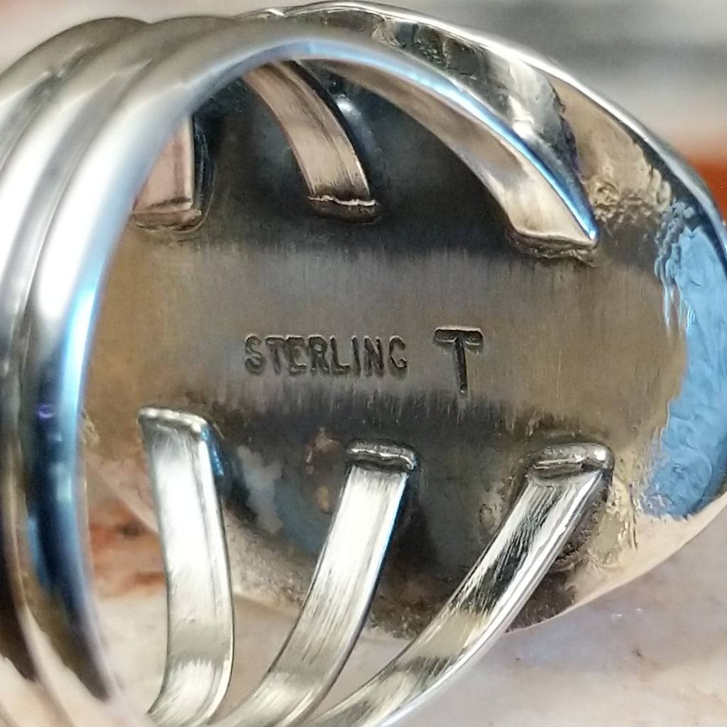 Close-up of the artisan's stamped signature.