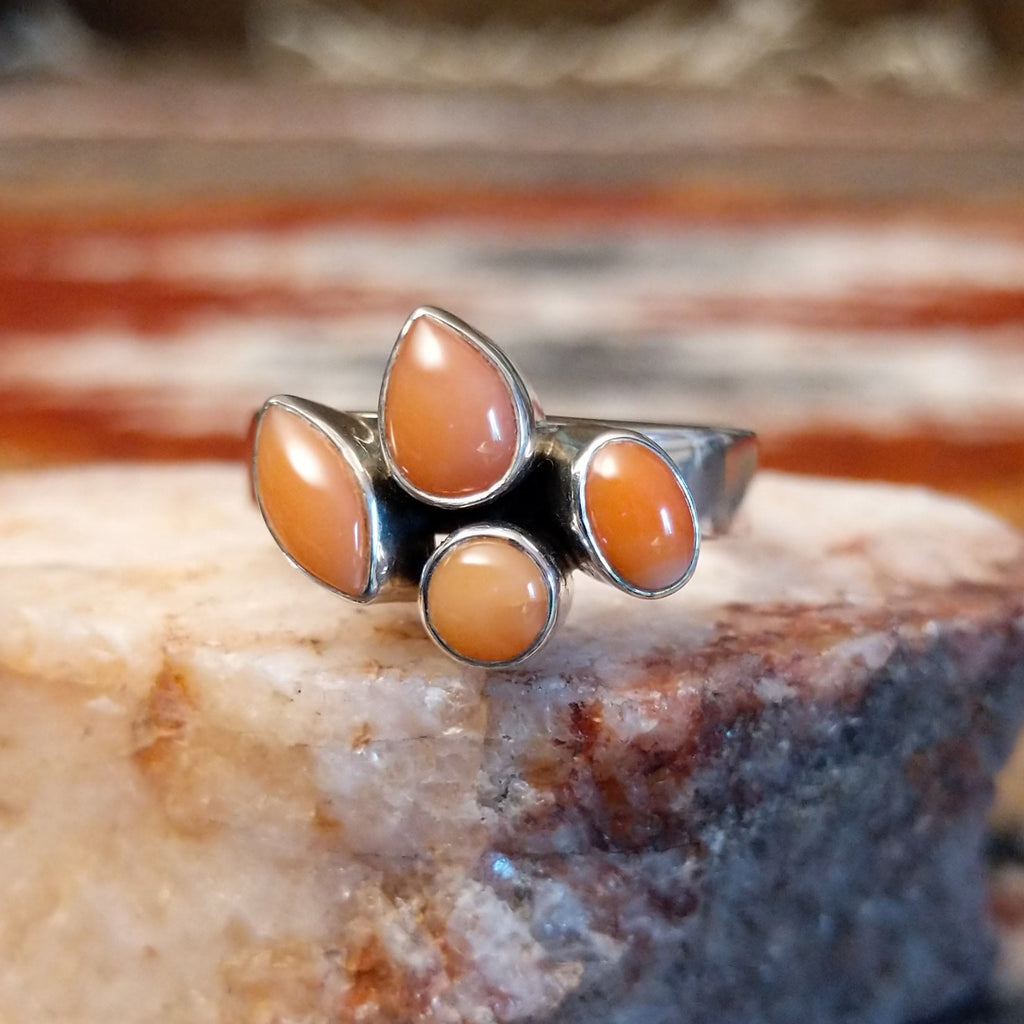 Sterling silver ring with pink coral quartet set on the polished band.