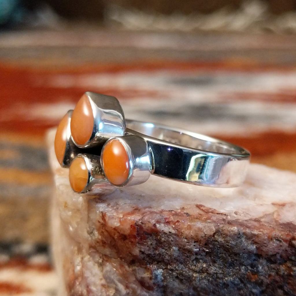 Sterling silver ring with pink coral quartet set on the polished band.