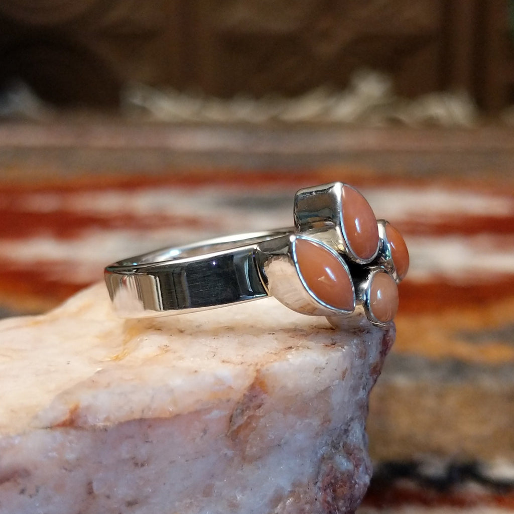 Sterling silver ring with pink coral quartet set on the polished band.