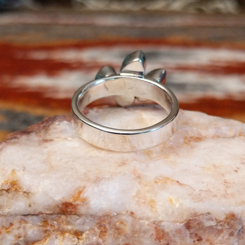 Sterling silver ring with pink coral quartet set on the polished band.