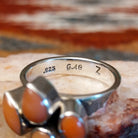 Close-up of the artisan's stamped signature.