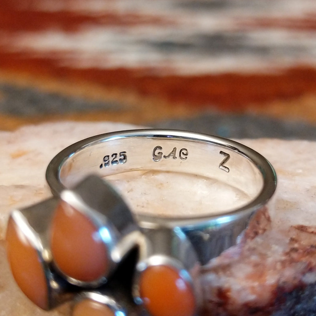 Close-up of the artisan's stamped signature.