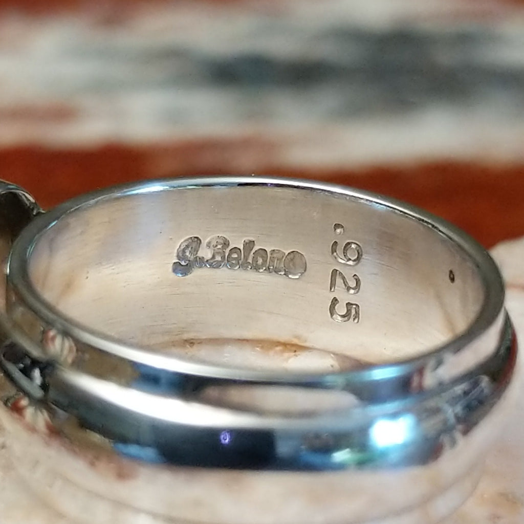 Close-up of the artisan's stamped signature.