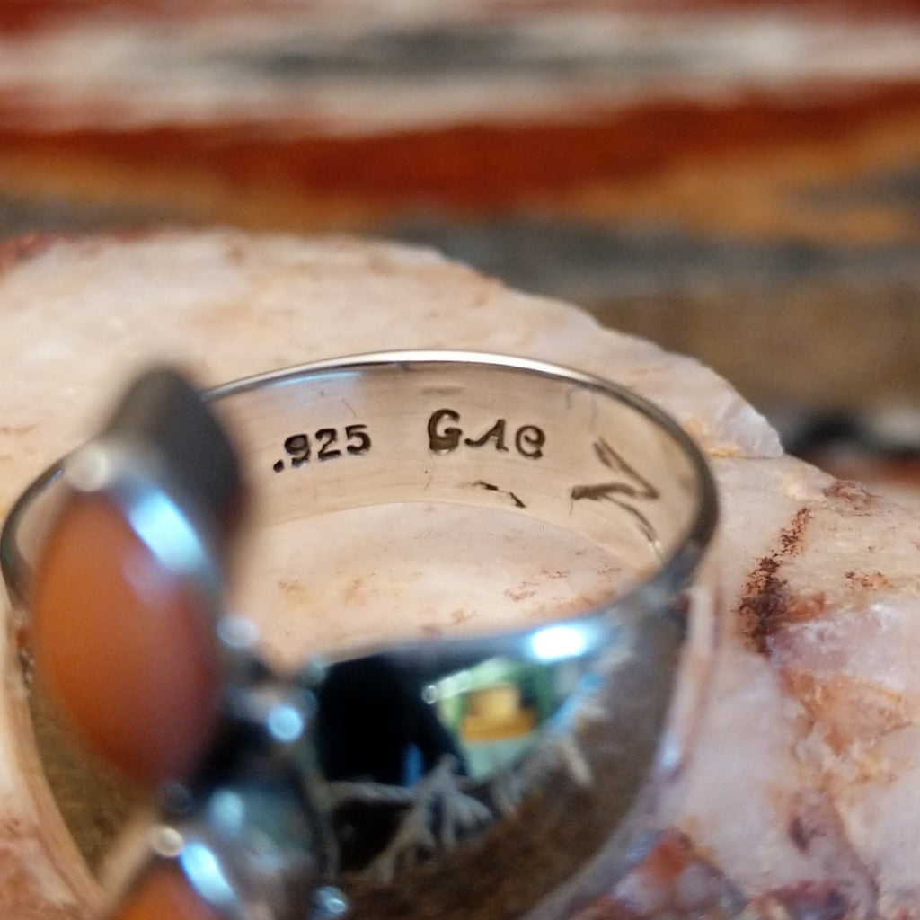 Close-up of the artisan's stamped signature.