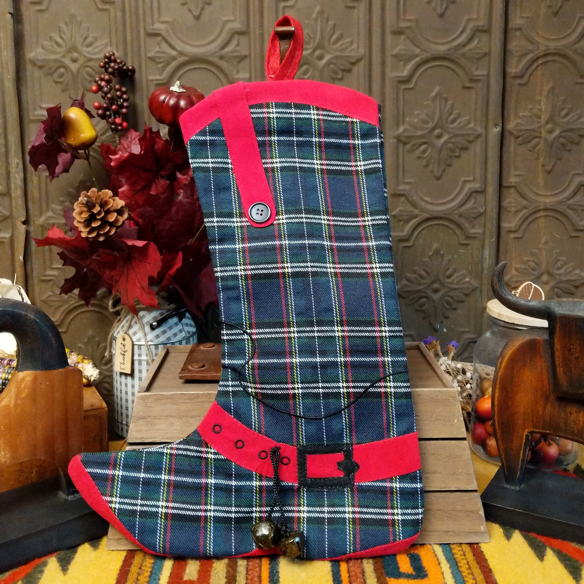 This charming collection of 18-inch Plaid Boot Stockings features cowboy boot designs in assorted plaid patterns with decorative buckles, snowflakes, festive accents, and hanging loops for Western Christmas decorating.