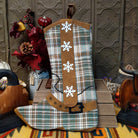 This charming collection of 18-inch Plaid Boot Stockings features cowboy boot designs in assorted plaid patterns with decorative buckles, snowflakes, festive accents, and hanging loops for Western Christmas decorating.