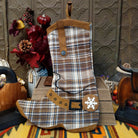 This charming collection of 18-inch Plaid Boot Stockings features cowboy boot designs in assorted plaid patterns with decorative buckles, snowflakes, festive accents, and hanging loops for Western Christmas decorating.