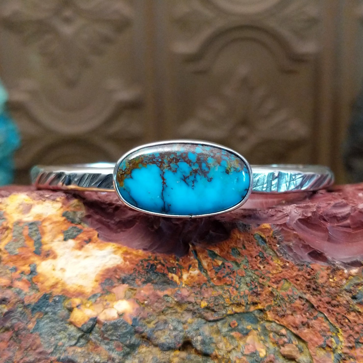Sterling silver cuff featuring Redskin turquoise set in an oval bezel.