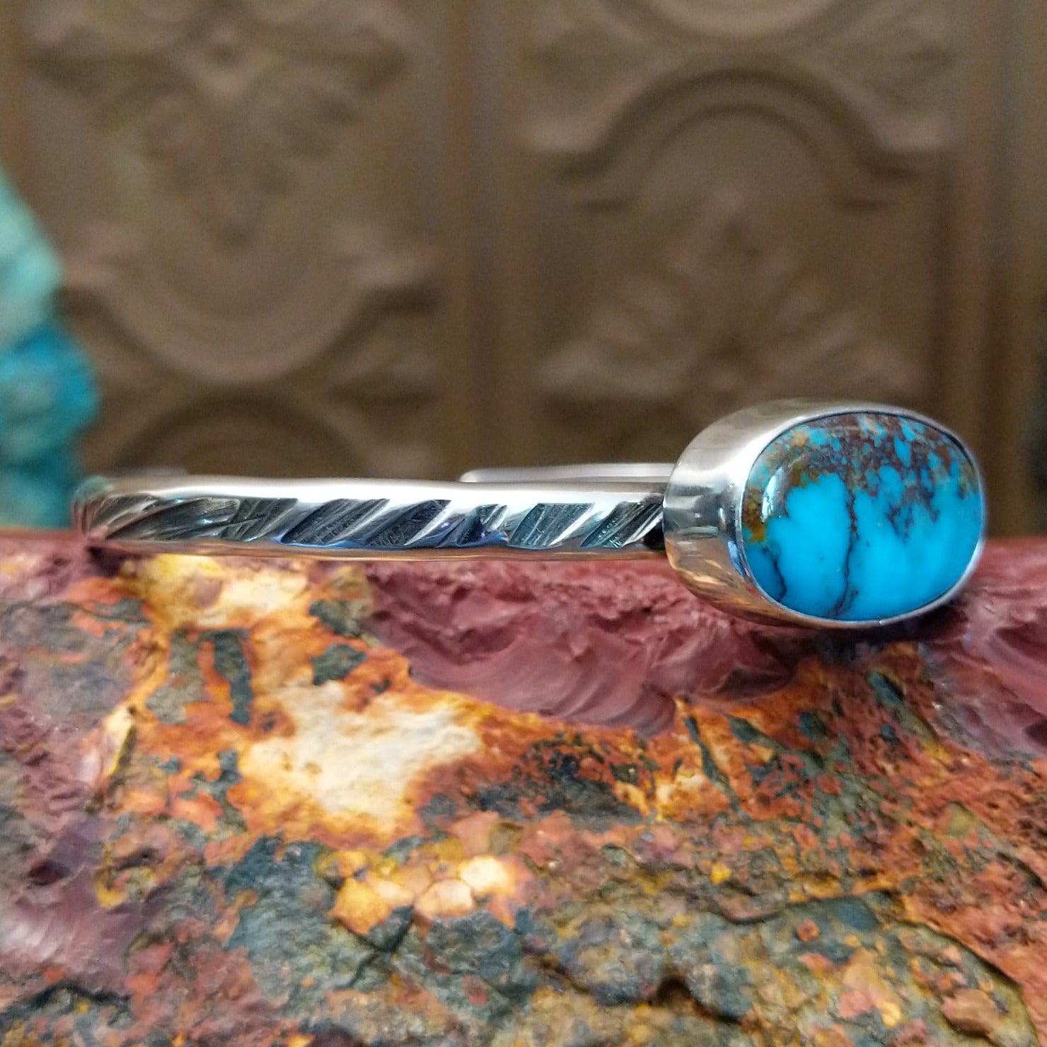 Sterling silver cuff featuring Redskin turquoise set in an oval bezel.
