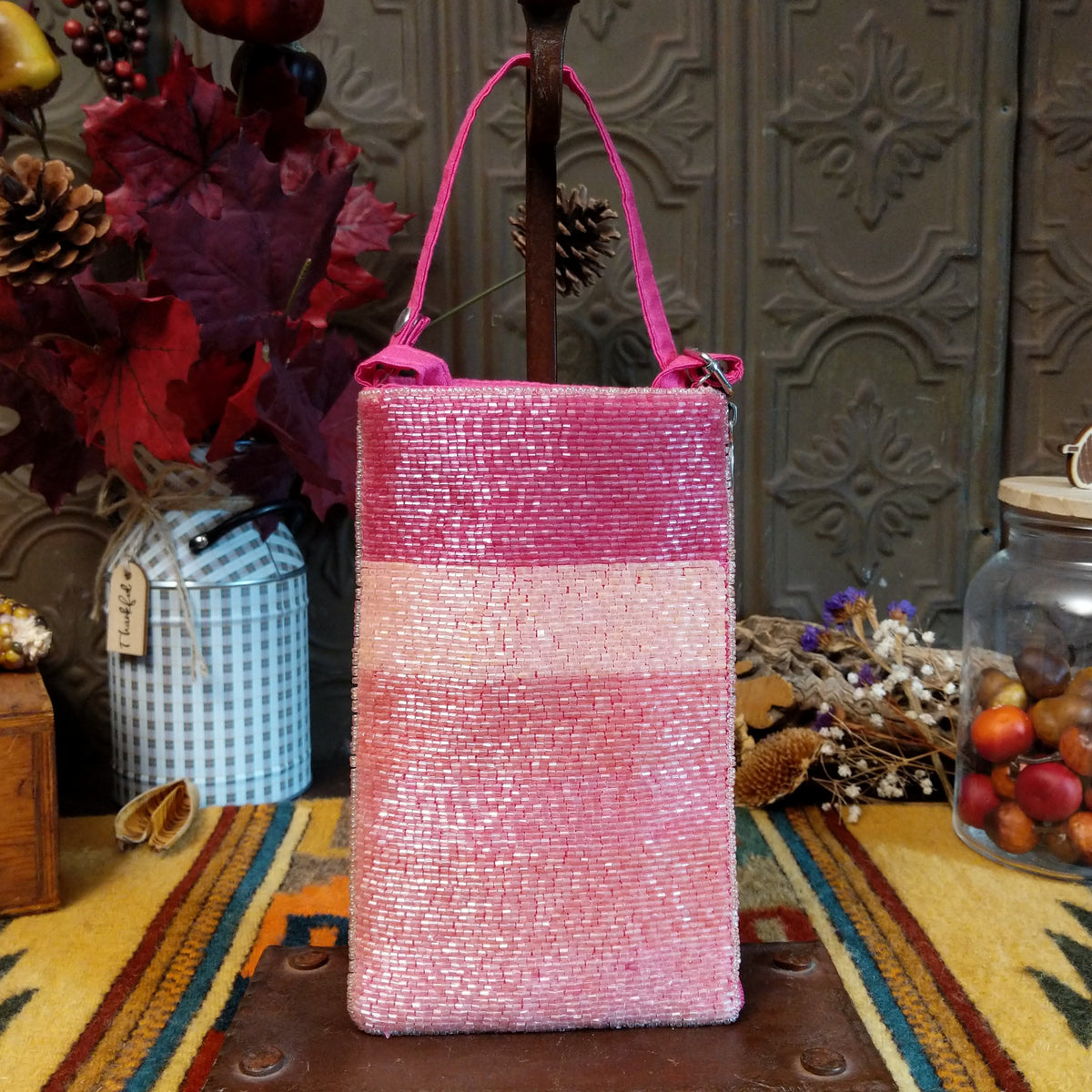 Pretty In Pink Club Bag by Bamboo Trading featuring shimmering pink and blush beaded horizontal stripes, a compact rectangular silhouette, and a coordinating bright pink shoulder strap.