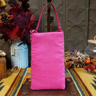 Pretty In Pink Club Bag by Bamboo Trading featuring shimmering pink and blush beaded horizontal stripes, a compact rectangular silhouette, and a coordinating bright pink shoulder strap; back side view.