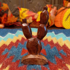 Ironwood smoothed and carved into a prickly pear cactus.
