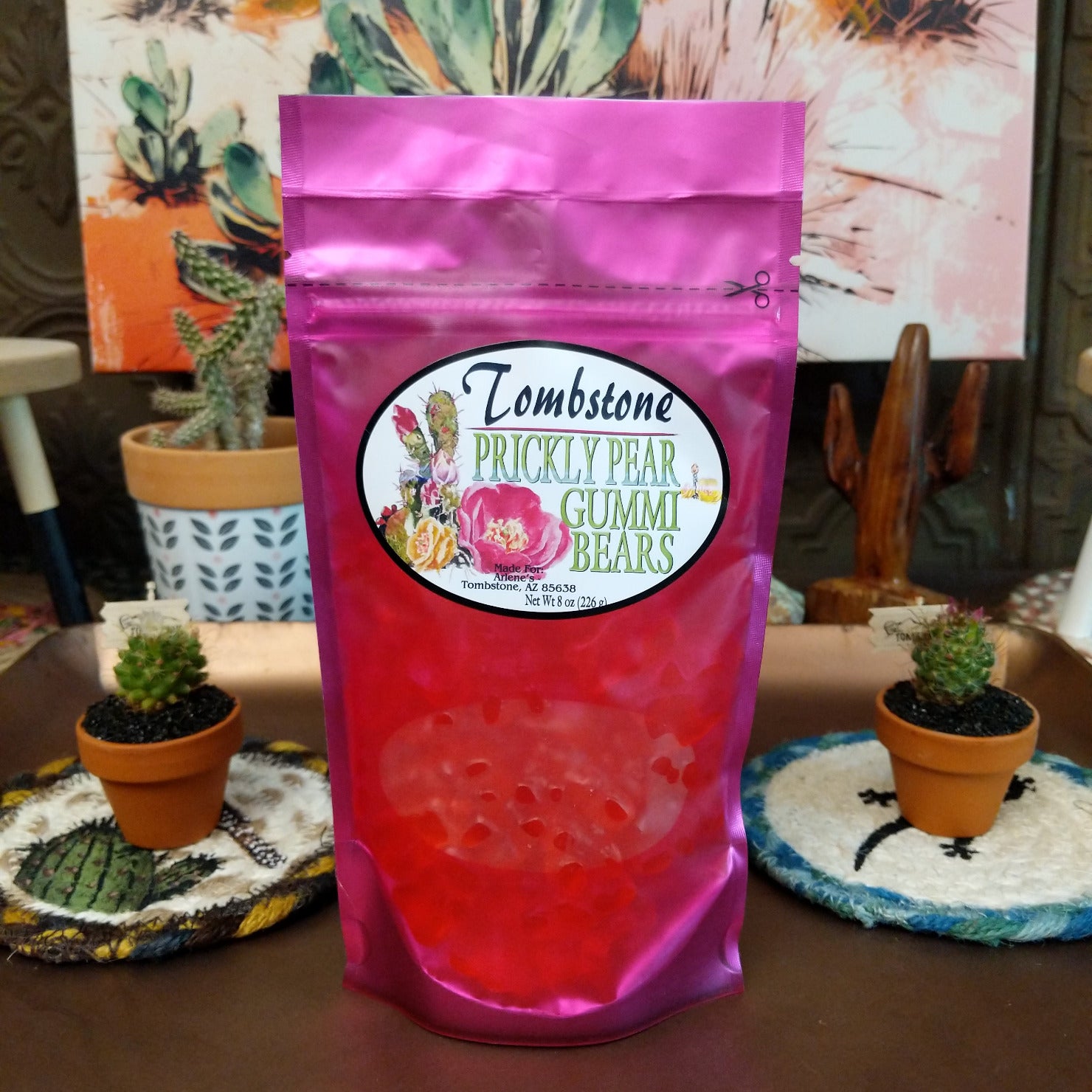 Colorful prickly pear gummy bears arranged in a pile, featuring vibrant pink and purple hues. Soft and chewy candy flavored with the sweet, fruity taste of prickly pear cactus fruit.