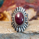 Oval purple spiny oyster shell set in sterling silver with twisted rope accents and ornate silver detailing.