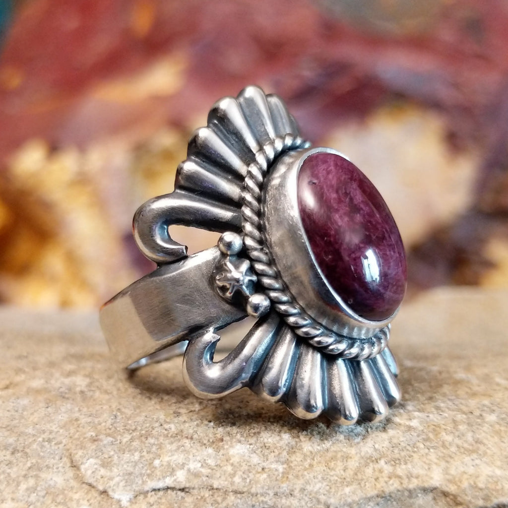 Oval purple spiny oyster shell set in sterling silver with twisted rope accents and ornate silver detailing.