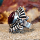 Oval purple spiny oyster shell set in sterling silver with twisted rope accents and ornate silver detailing.