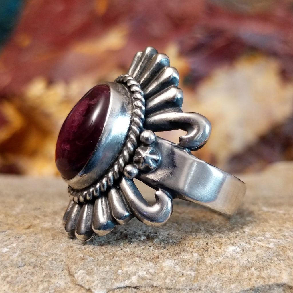 Oval purple spiny oyster shell set in sterling silver with twisted rope accents and ornate silver detailing.