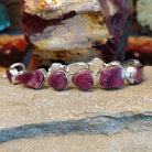 A purple spiny oyster shell link bracelet set in sterling silver.