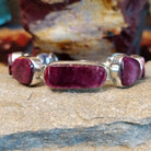 A purple spiny oyster shell link bracelet set in sterling silver.