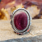 Oval purple spiny oyster shell set in a twisted rope and incised sterling silver setting.