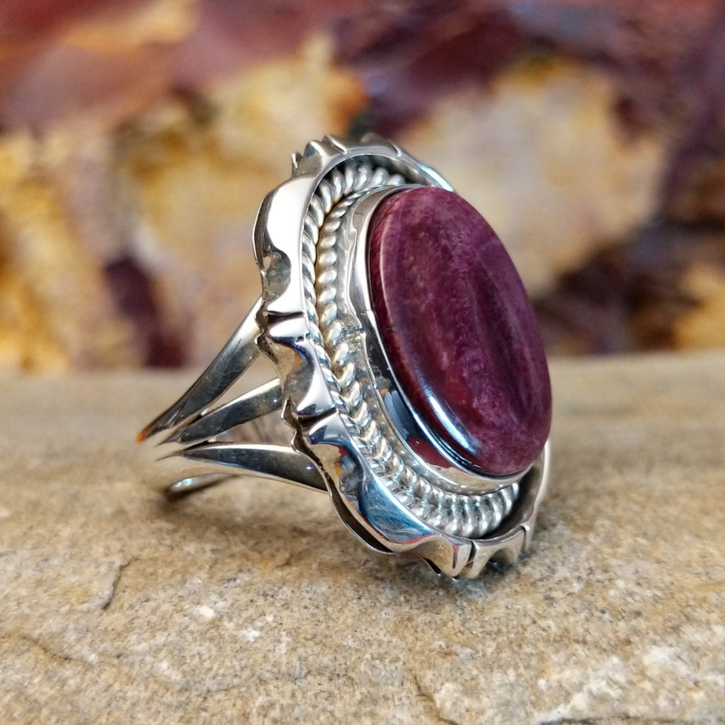 Oval purple spiny oyster shell set in a twisted rope and incised sterling silver setting.