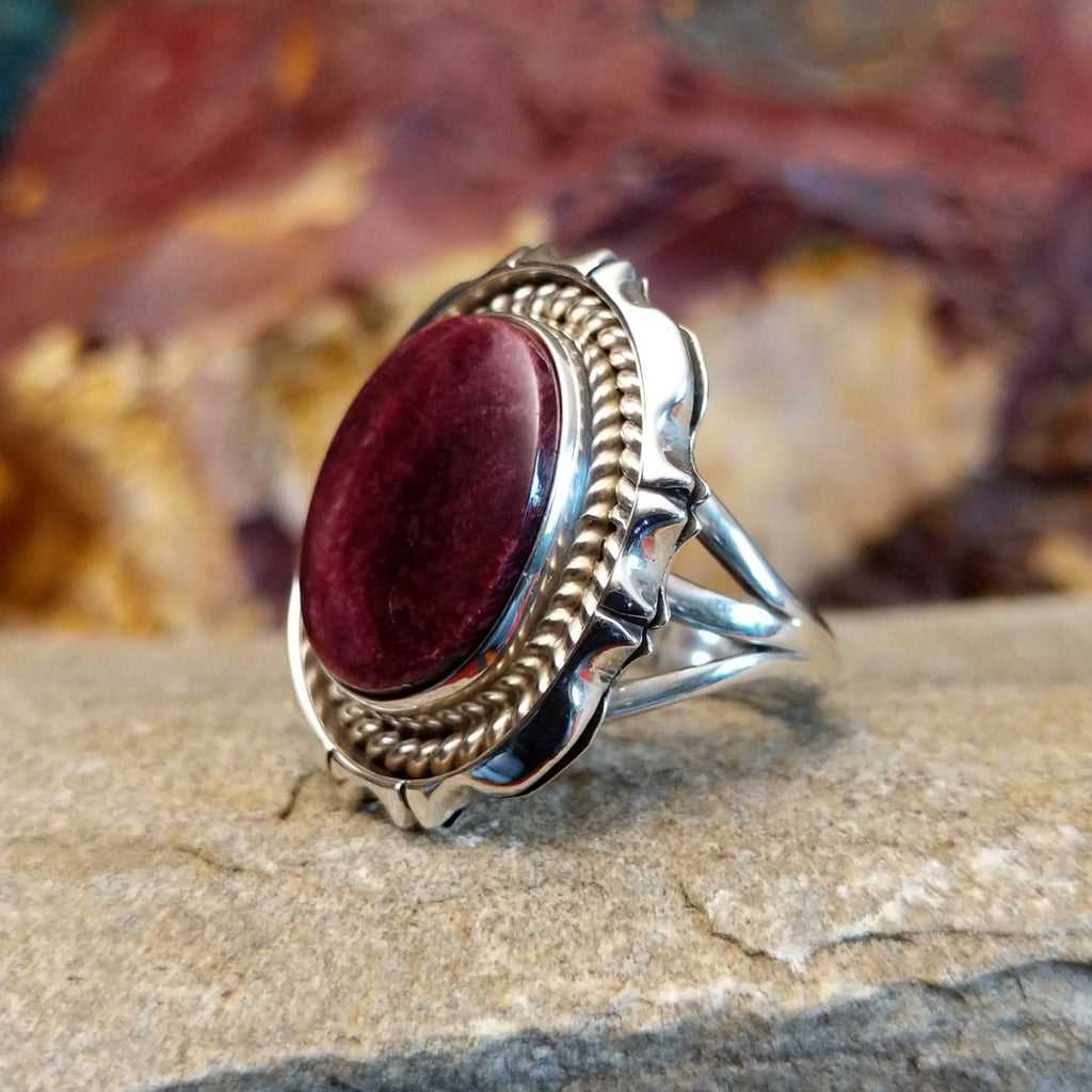 Oval purple spiny oyster shell set in a twisted rope and incised sterling silver setting.