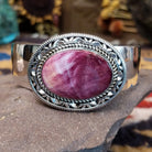 Sterling silver cuff featuring purple spiny oyster shell set in a twisted rope bezel.