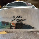 Close up of the artist's stamped signature.