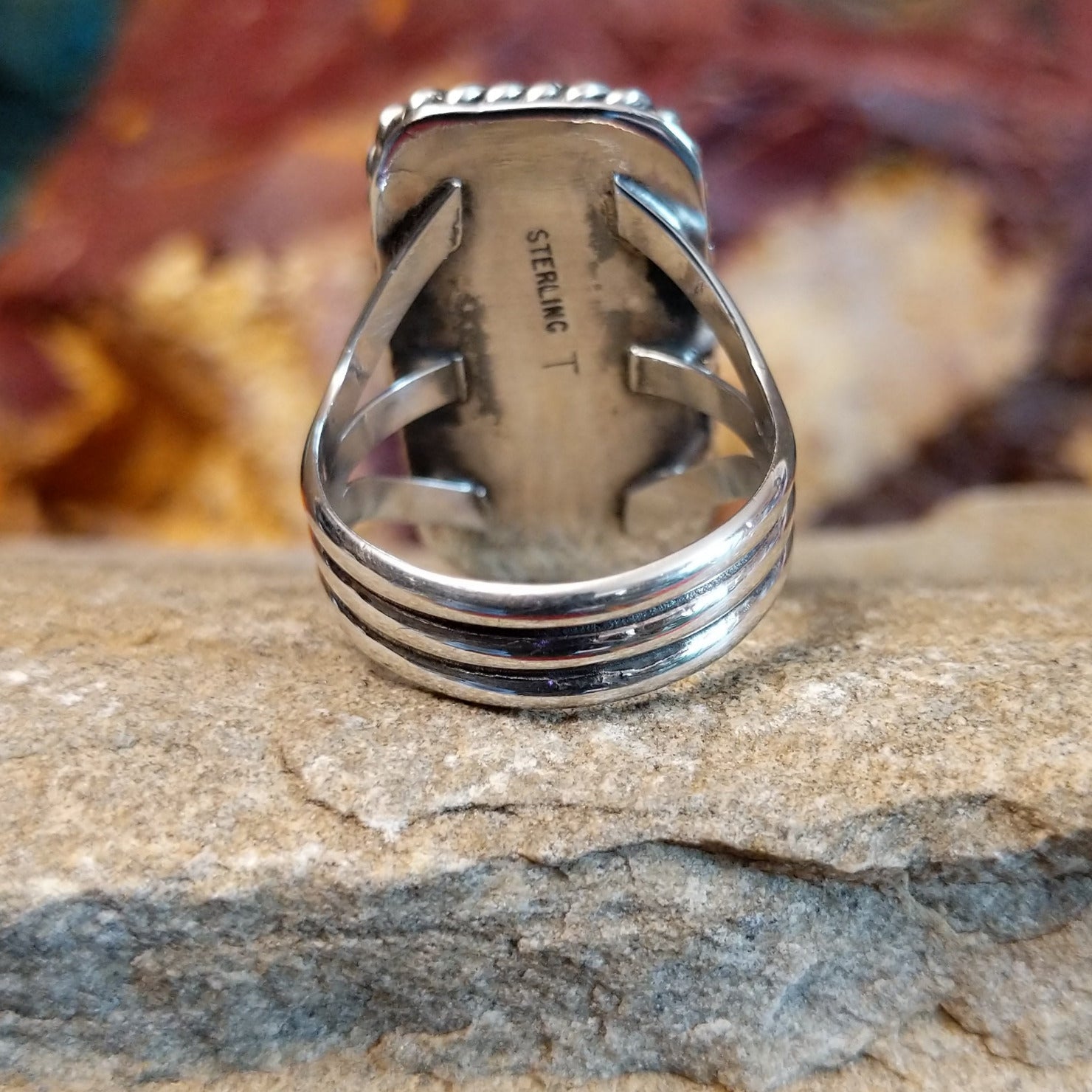 Tri-layered sterling silver band of the ring.